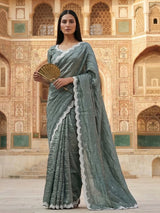 Rama green tissue silk saree with elegant embellishments