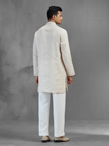 Cream linen subtle zari motif wedding kurta suit