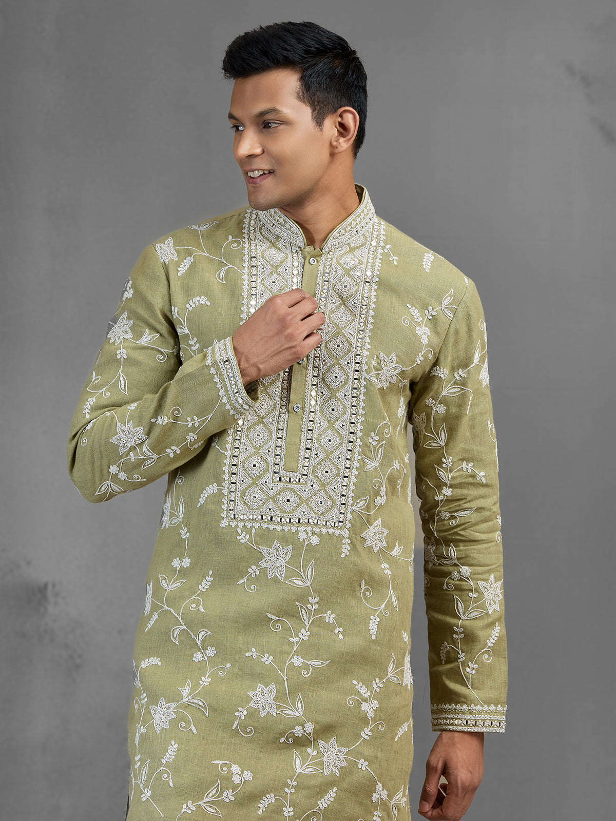 Green linen heritage aari crafted festive kurta suit