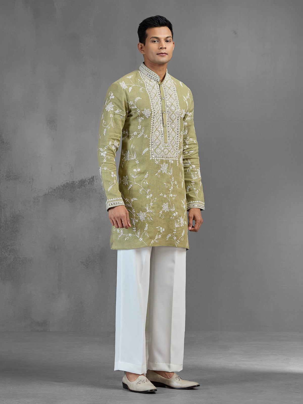 Green linen heritage aari crafted festive kurta suit