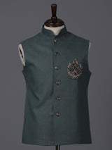 Dark green linen heavily embellished waistcoat with brooch