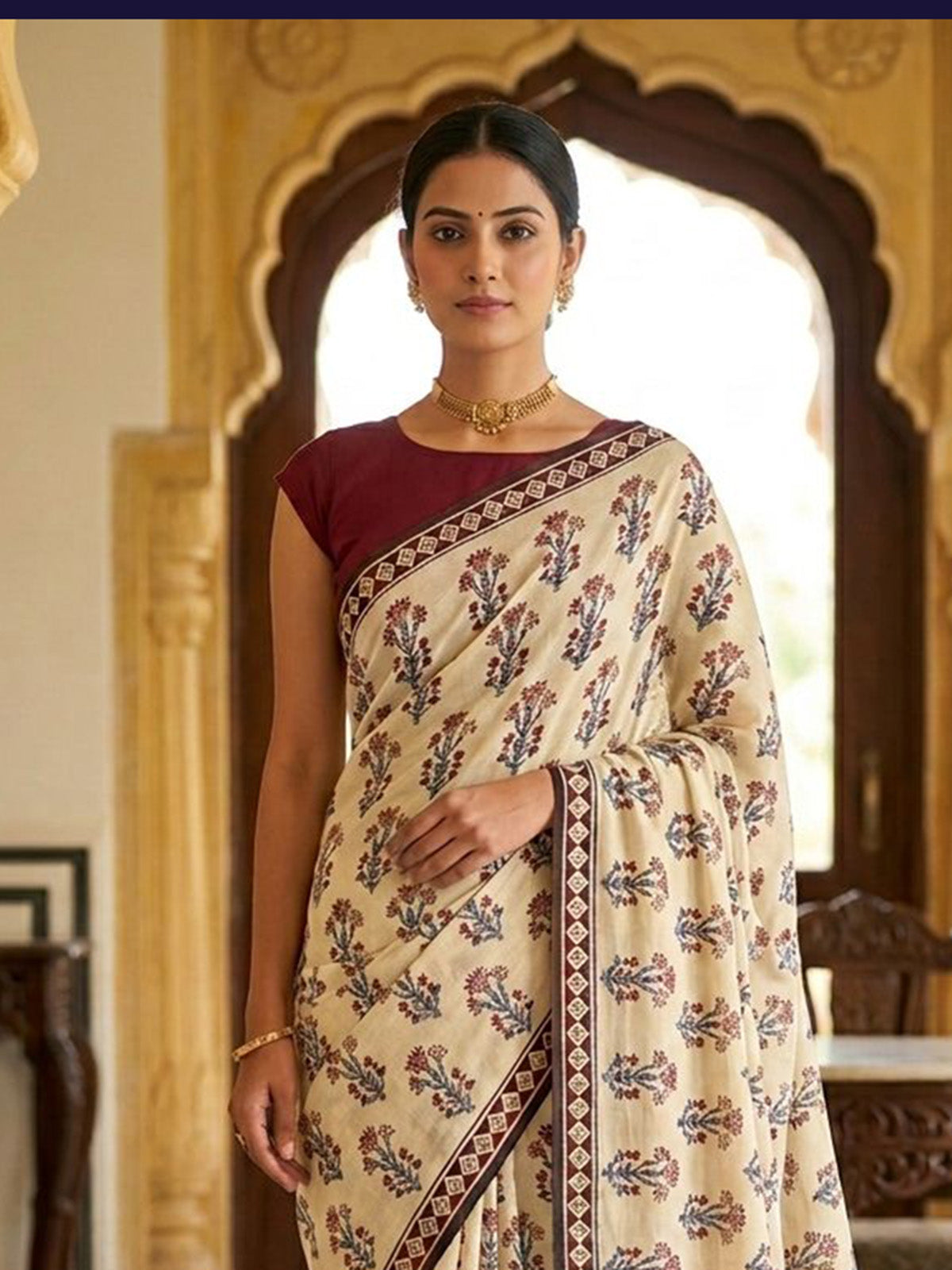 Beige muslin saree with ethnic print