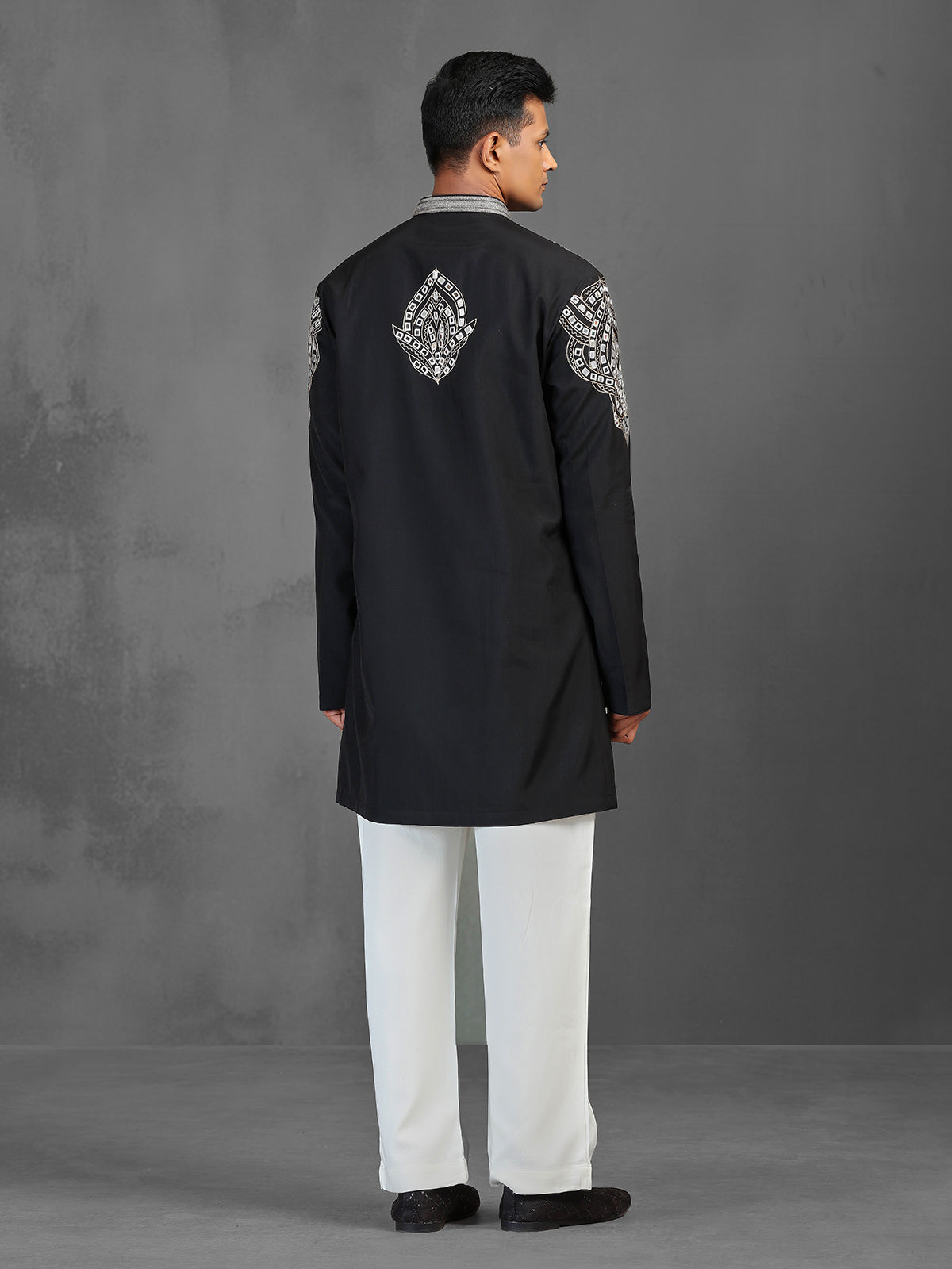 Black art silk kurta suit for a charming wedding look