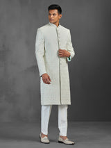 Light pista silk sherwani with thread and stone detailing