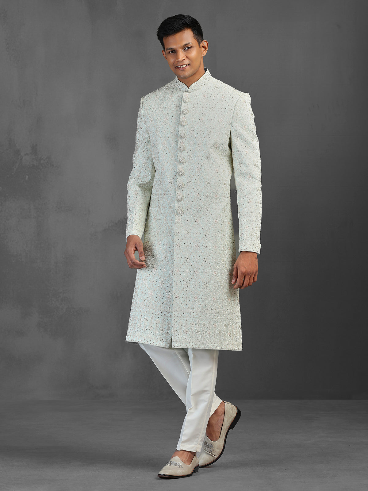 Light pista silk sherwani with thread and stone detailing
