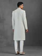 Light pista silk sherwani with thread and stone detailing