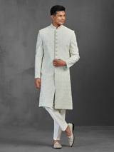 Light pista silk sherwani with thread and stone detailing