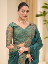 Rama green wedding tissue saree for festive celebration