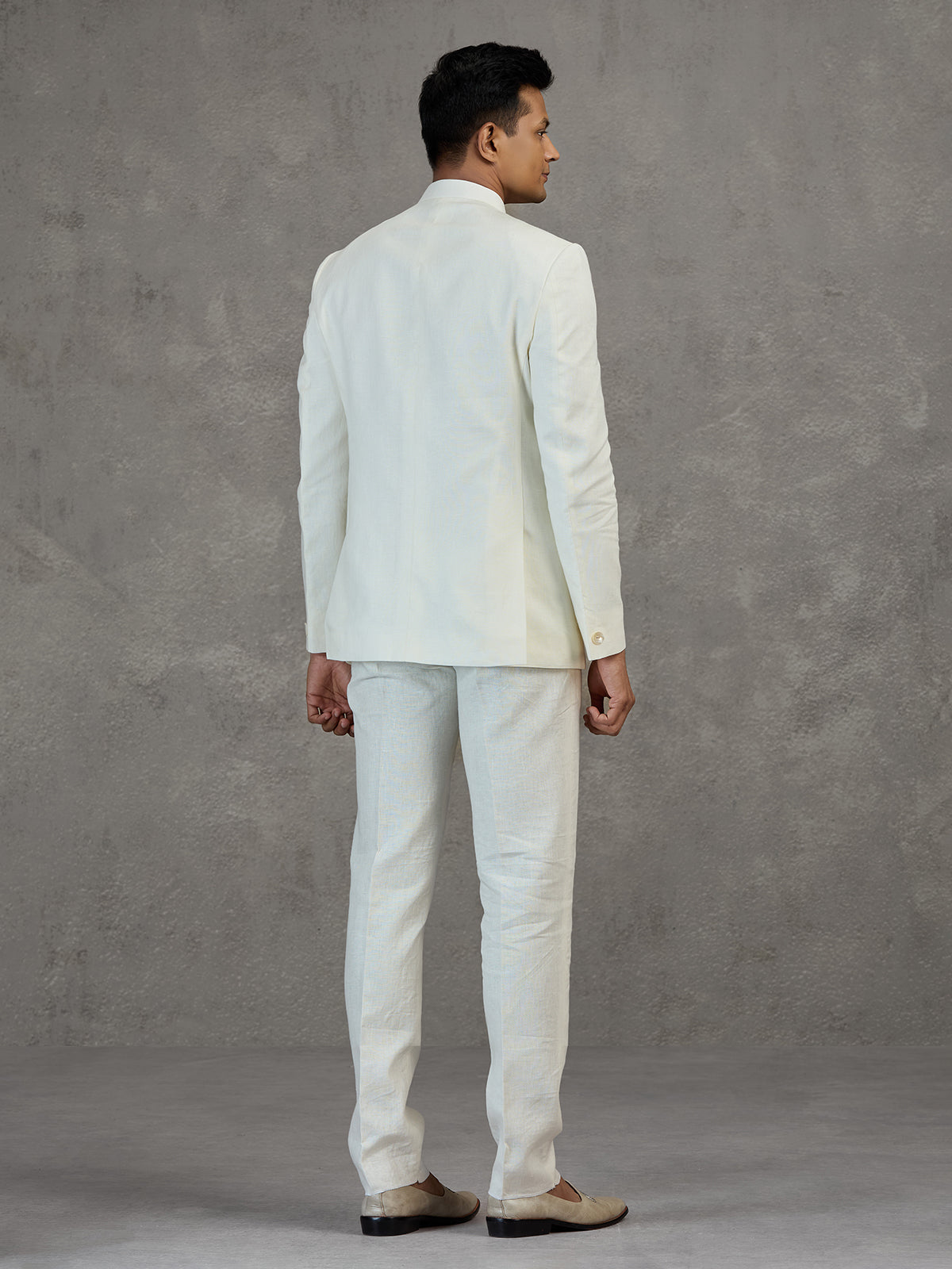 Ivory white wedding jodhpuri suit with metallic detailing