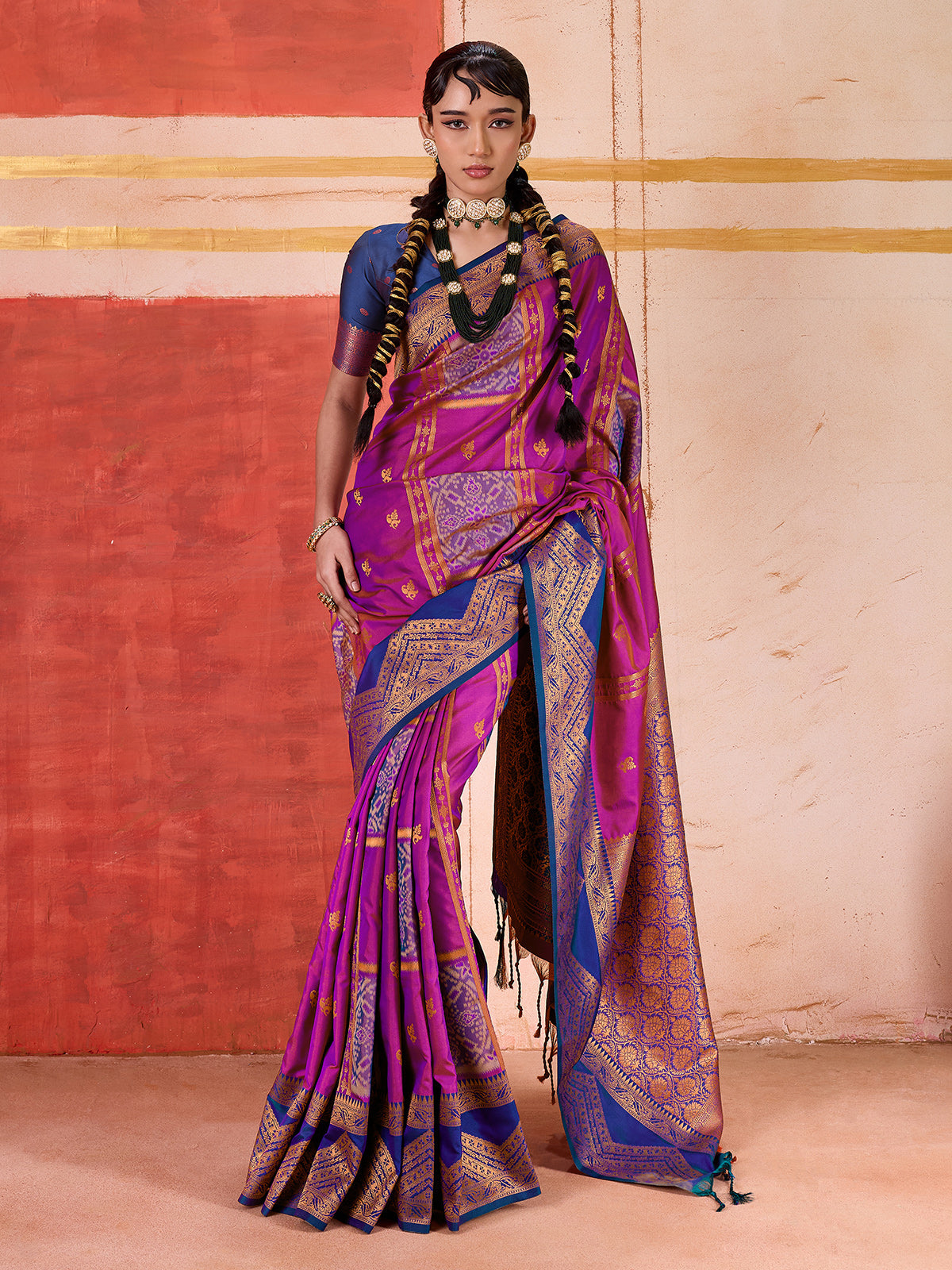 Violet silk saree with bold green and blue accents