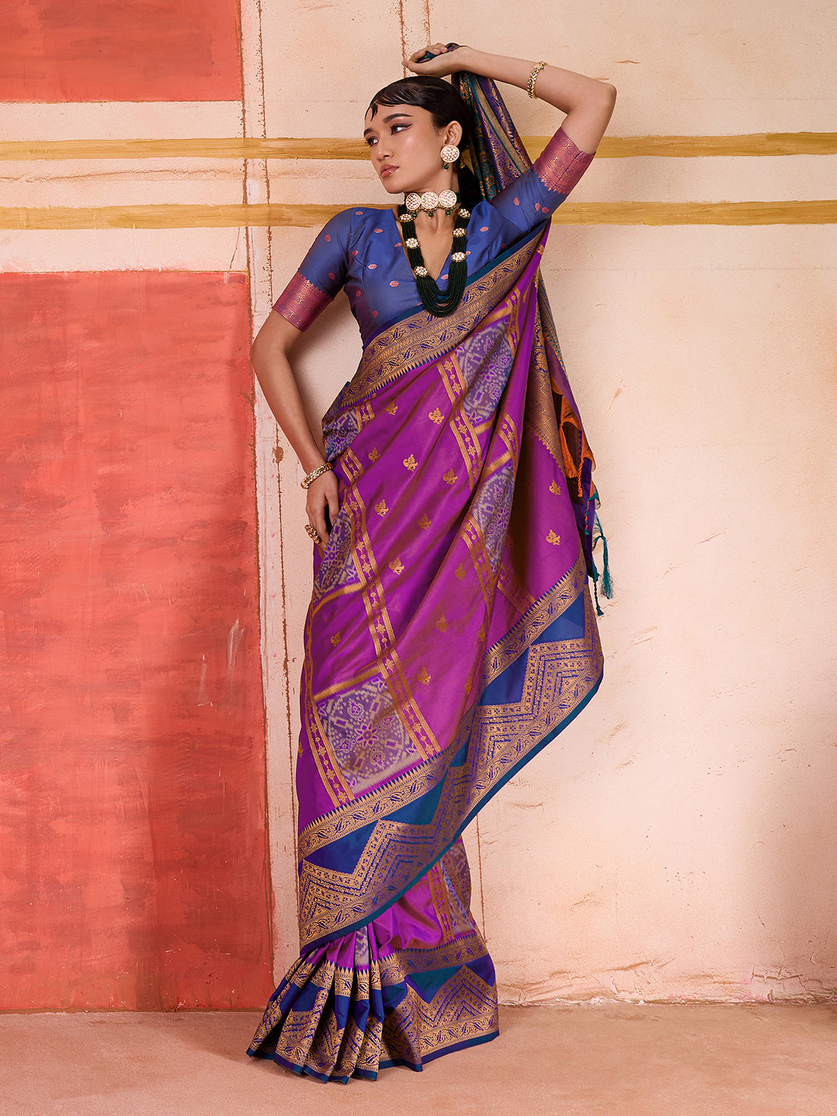 Violet silk saree with bold green and blue accents