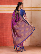 Violet silk saree with bold green and blue accents