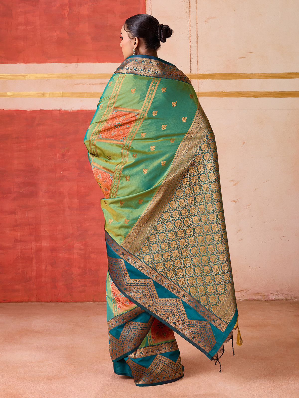Green silk saree with highlighted contrasting border