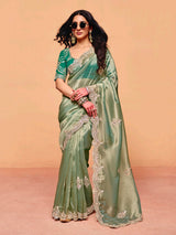 Pastel pista green tissue silk festive wear saree