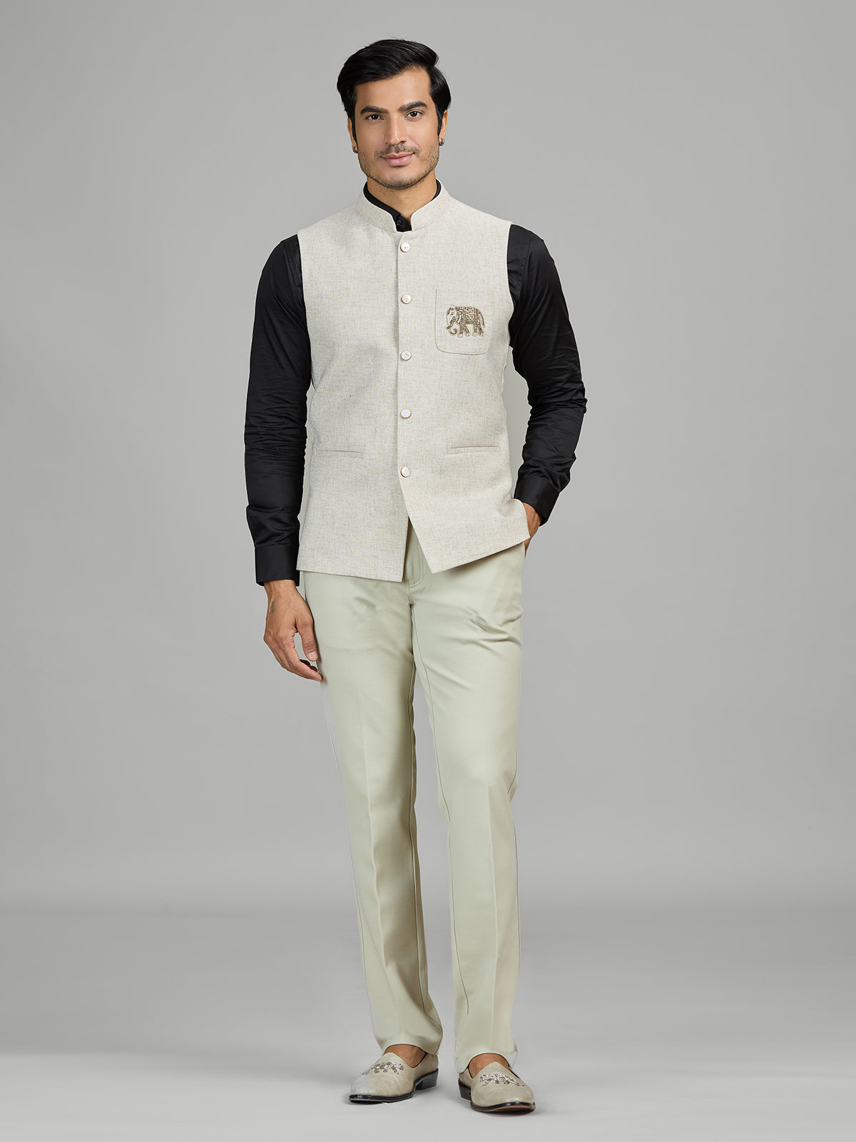 Light beige linen waistcoat for reception wear with crest detailing