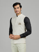 Light beige linen waistcoat for reception wear with crest detailing