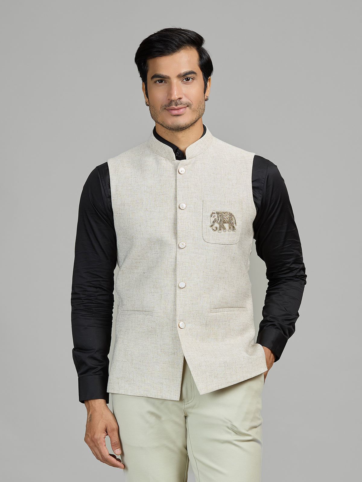 Light beige linen waistcoat for reception wear with crest detailing