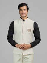 Light beige linen waistcoat for reception wear with crest detailing