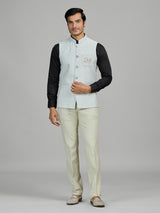 Mint blue linen wedding waistcoat with embellished pocket