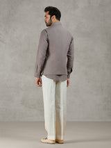Grey linen waistcoat set with zardosi embellished crest