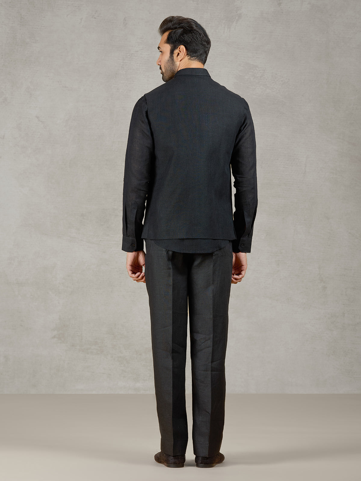 Black party wear linen waistcoat set with embellished crest
