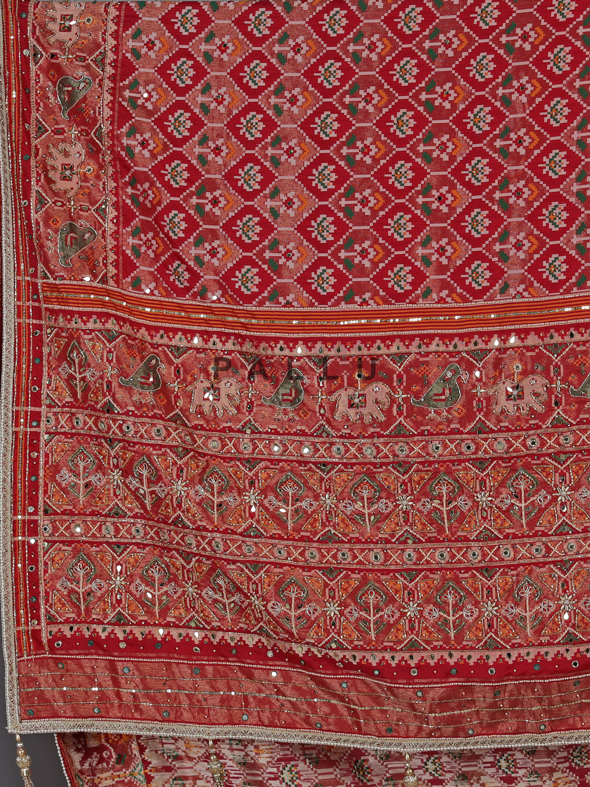Crimson maroon art patola silk saree with embellished detailing