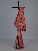 Crimson maroon art patola silk saree with embellished detailing