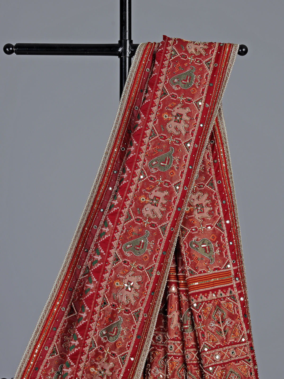 Crimson maroon art patola silk saree with embellished detailing