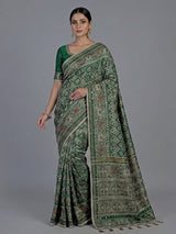 Green art patola silk saree with sequins and zardosi accents