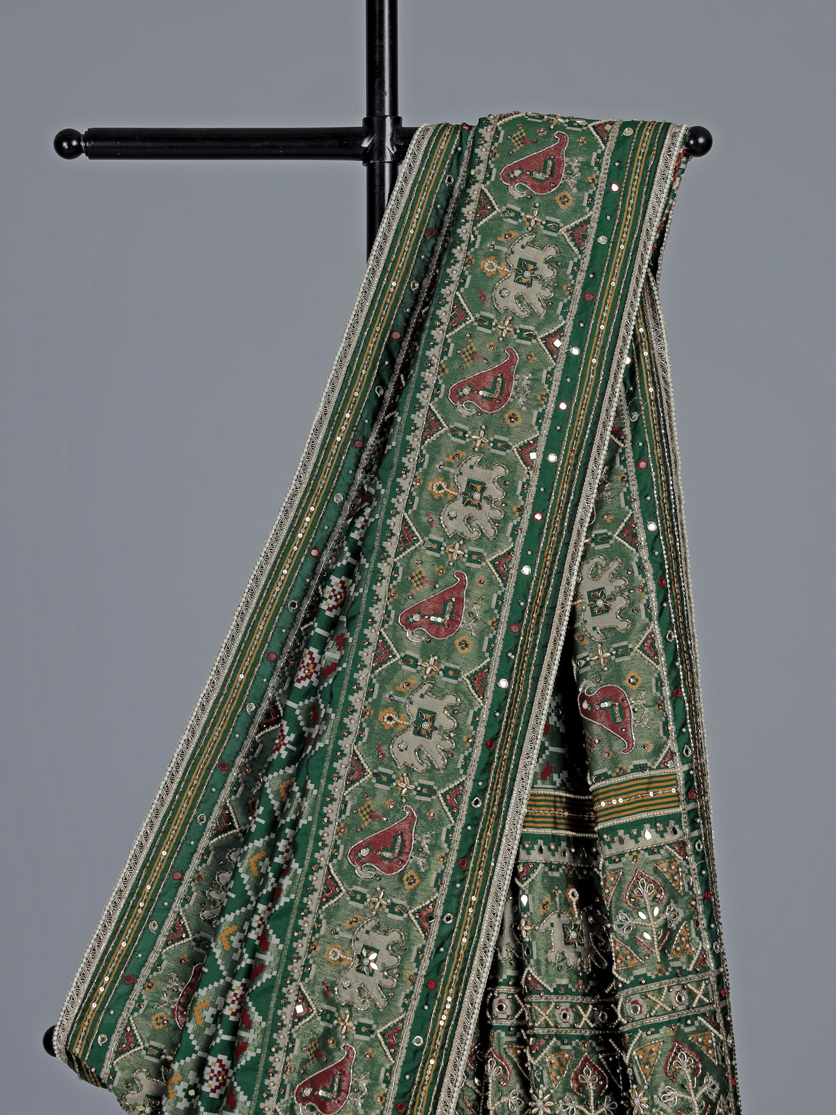 Green art patola silk saree with sequins and zardosi accents