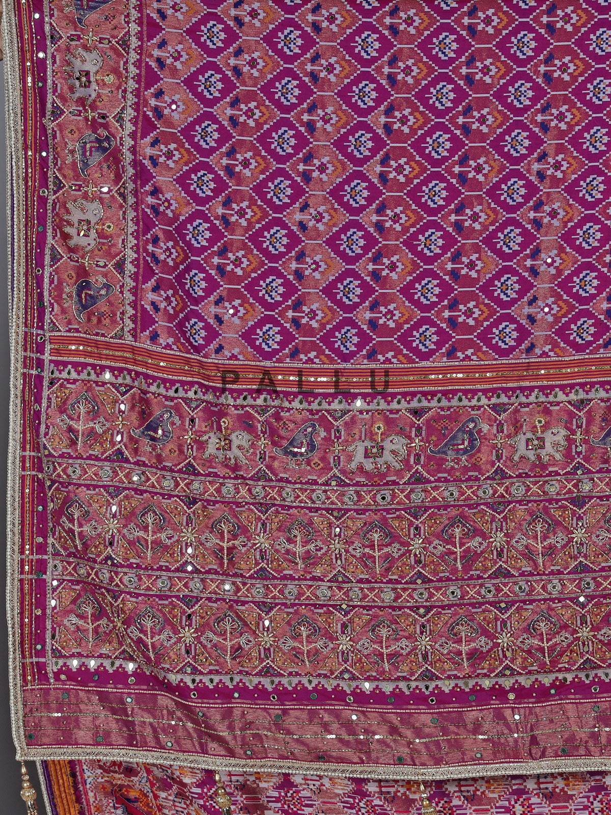 Regal purple art patola silk saree with ornate embellishments