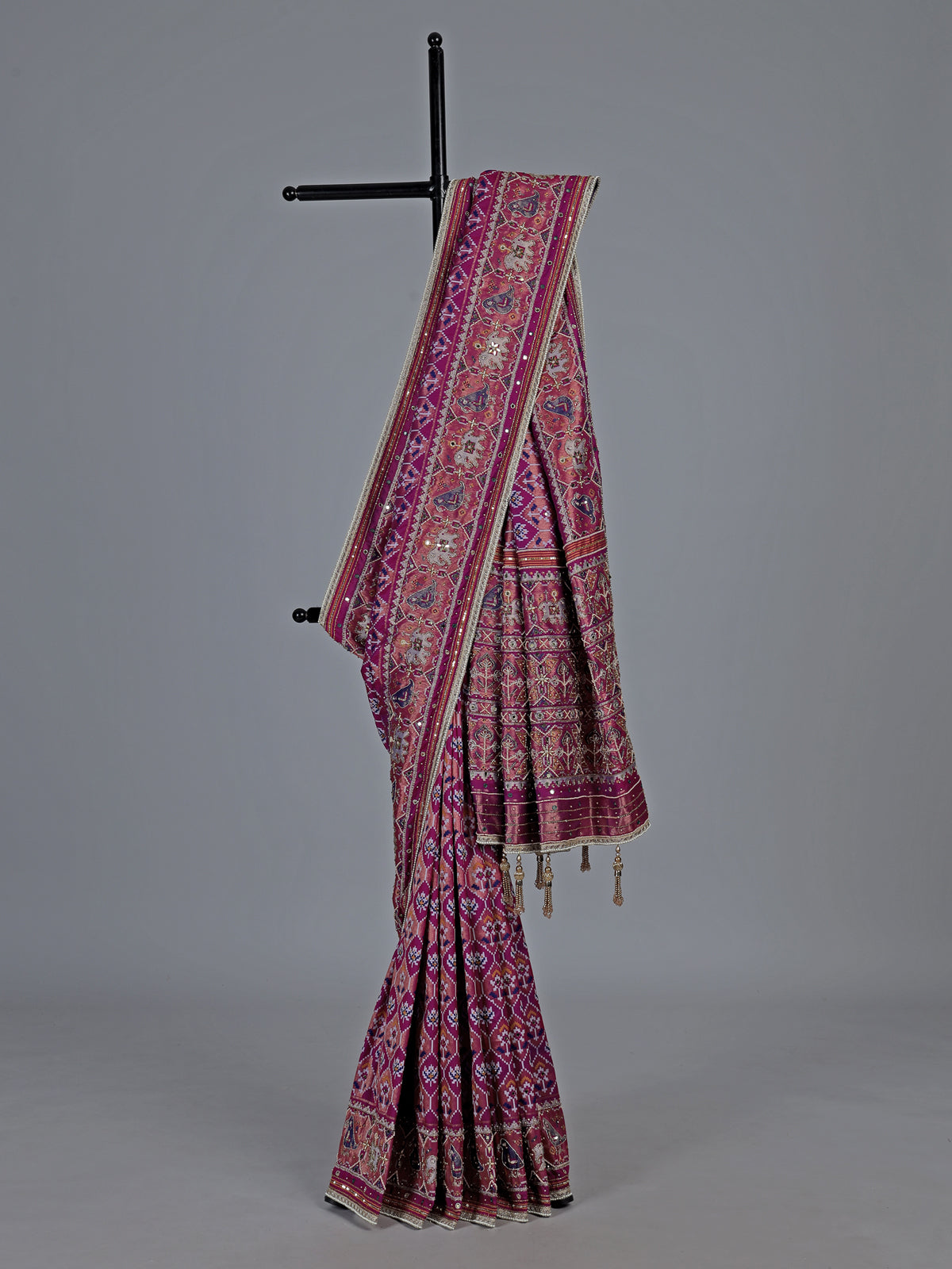 Regal purple art patola silk saree with ornate embellishments