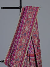 Regal purple art patola silk saree with ornate embellishments