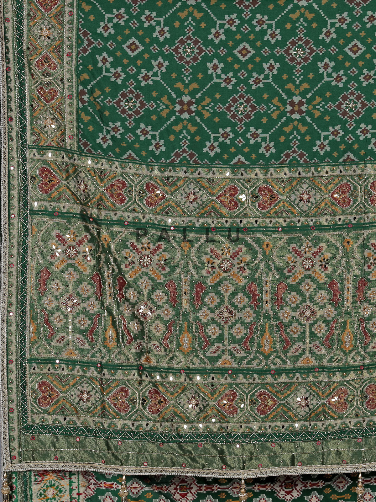 Green art patola silk saree with intricate handcrafted detailing