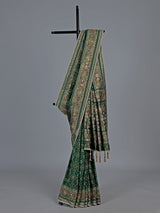 Green art patola silk saree with intricate handcrafted detailing