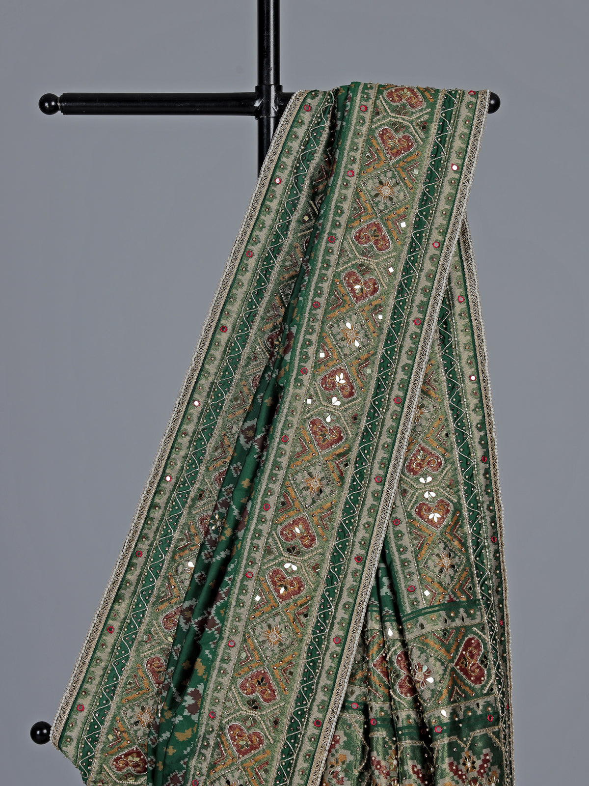 Green art patola silk saree with intricate handcrafted detailing