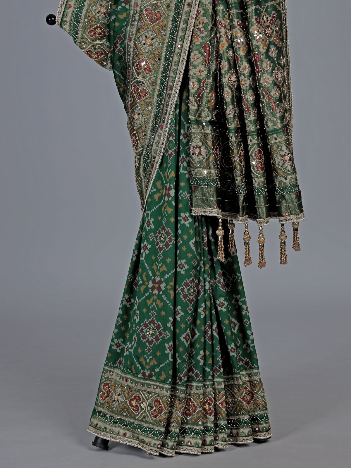Green art patola silk saree with intricate handcrafted detailing