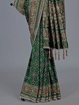 Green art patola silk saree with intricate handcrafted detailing