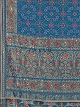 Bright blue art patola silk saree with shimmering embellishments