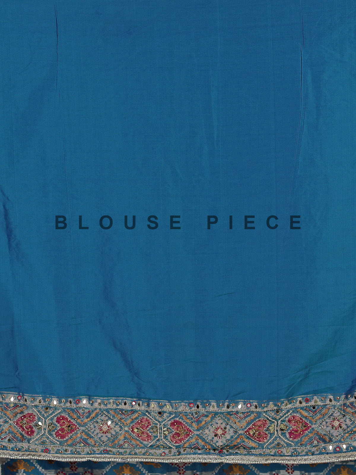 Bright blue art patola silk saree with shimmering embellishments