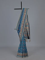 Bright blue art patola silk saree with shimmering embellishments