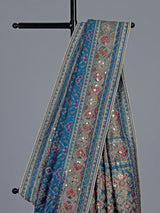Bright blue art patola silk saree with shimmering embellishments