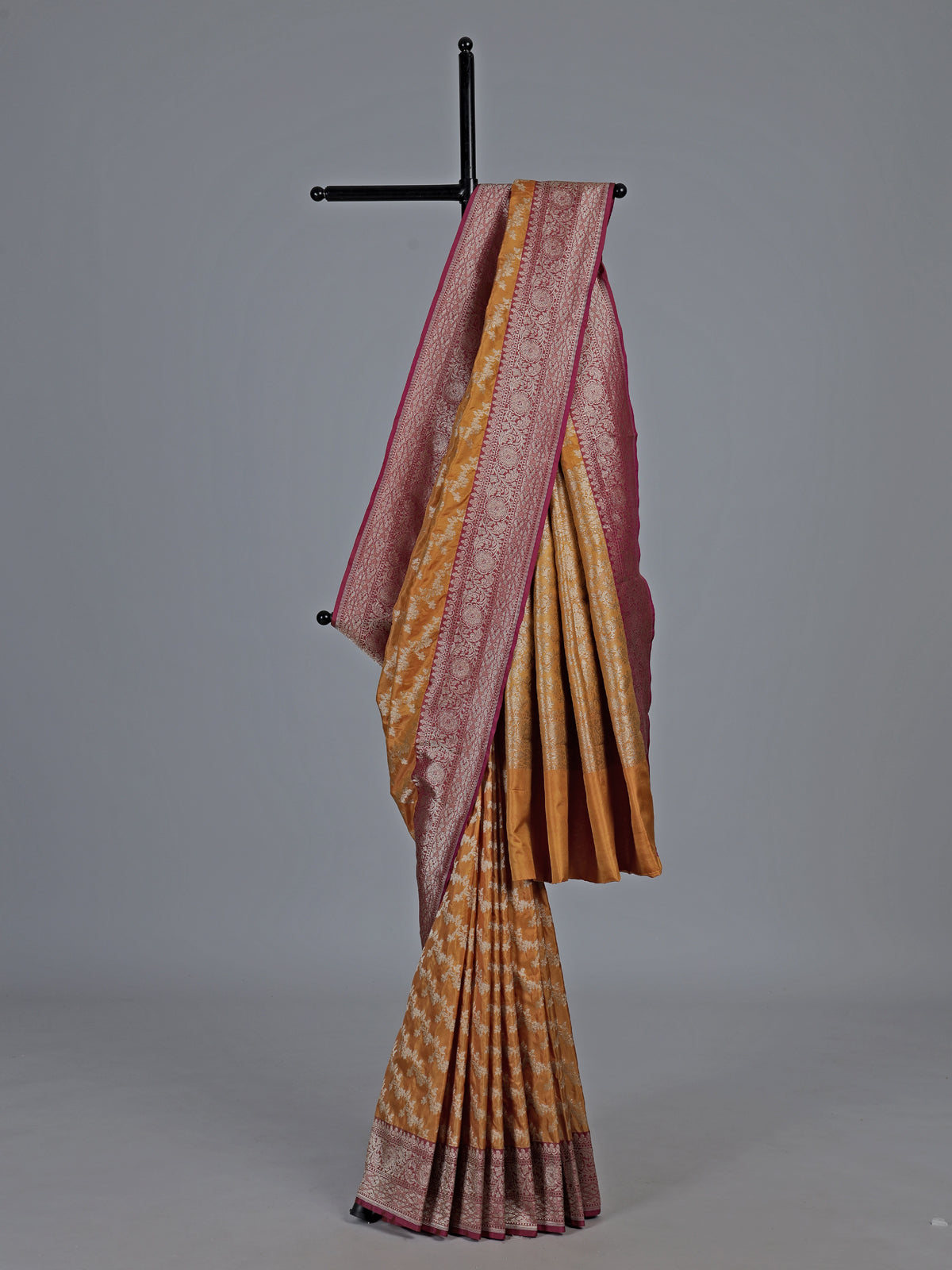 Mustard yellow banarasi silk saree with magenta zari border