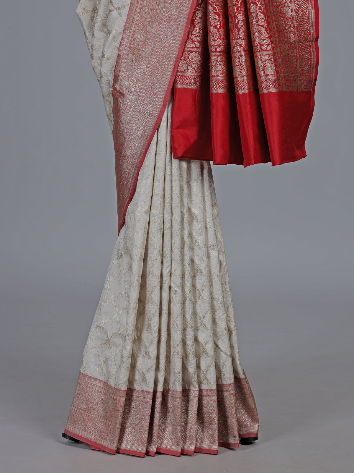 Off white banarasi silk saree with delicate zari detailing