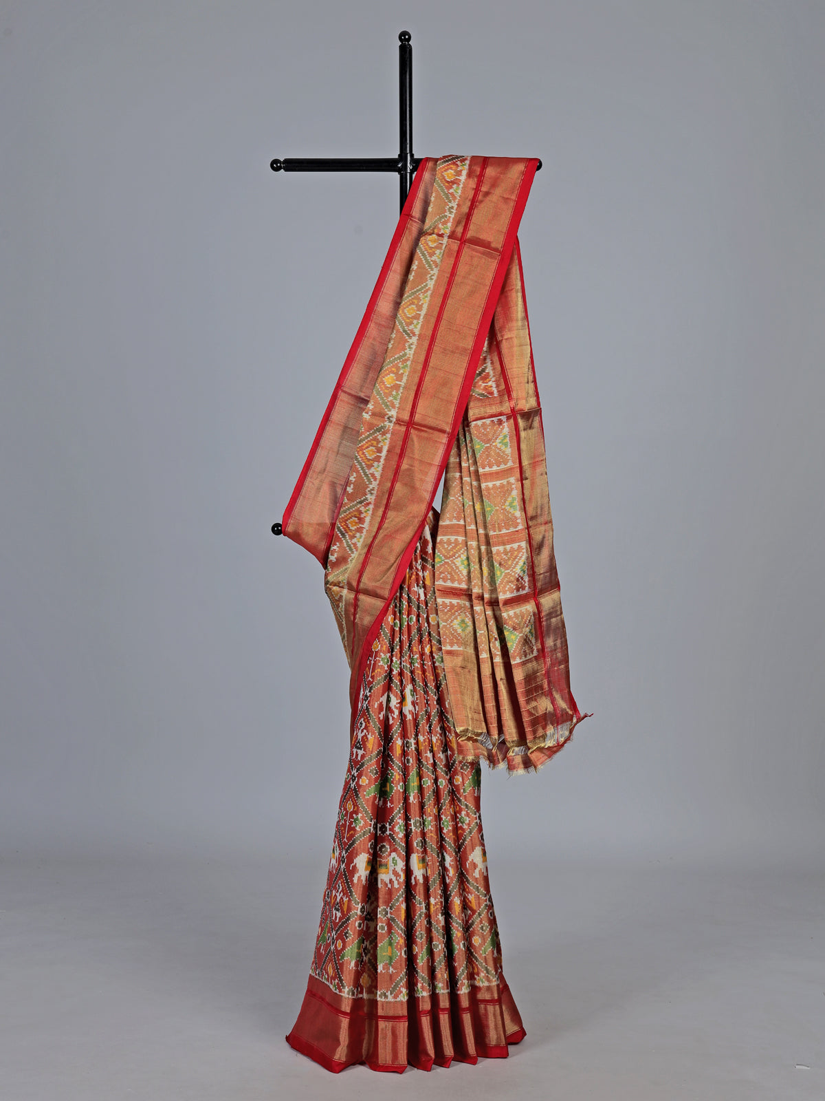 Light brown hyderabadi patola silk saree with heritage motifs