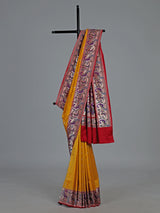 Mustard yellow banarasi silk saree with peacock zari border