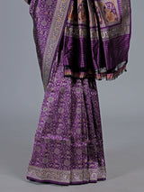 Dark purple banarasi silk saree with intricate zari motifs