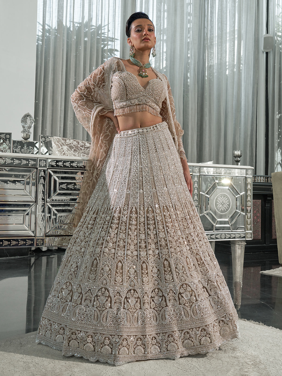 Beige net embellished lehenga choli with cutdana and sequins