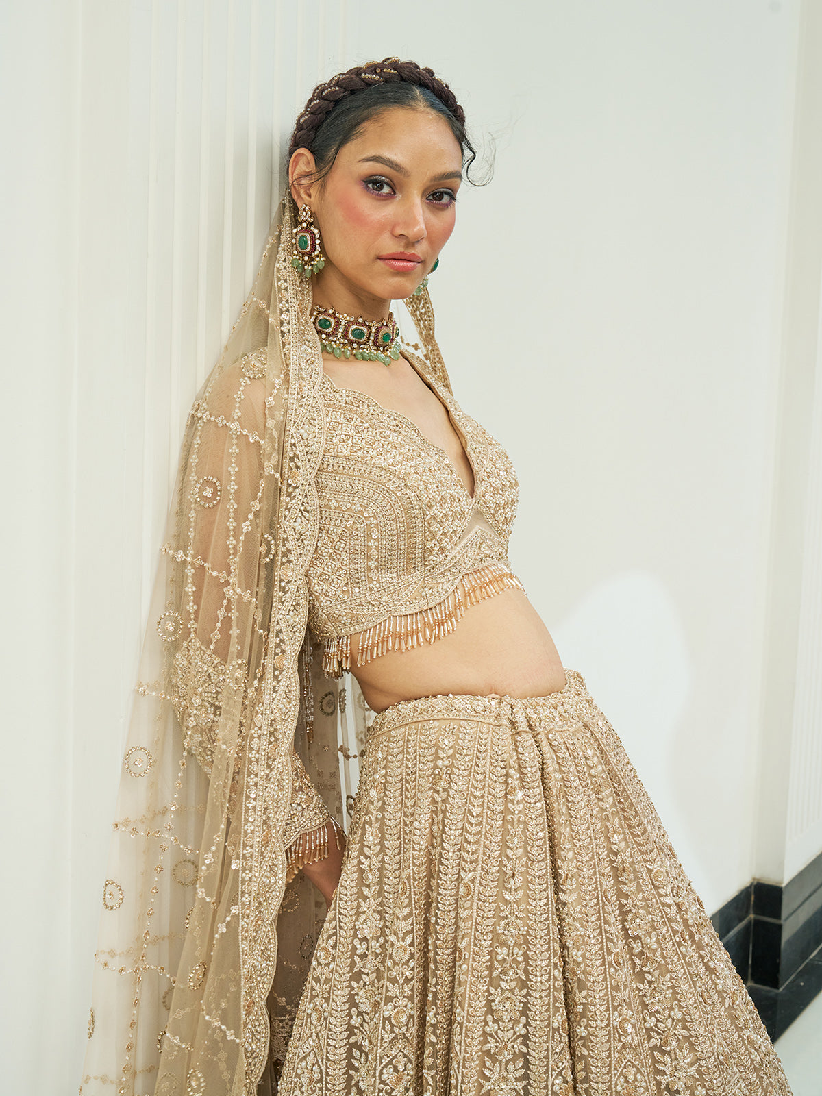 Beige net heavy embroidered lehenga choli with diamond and cutdana