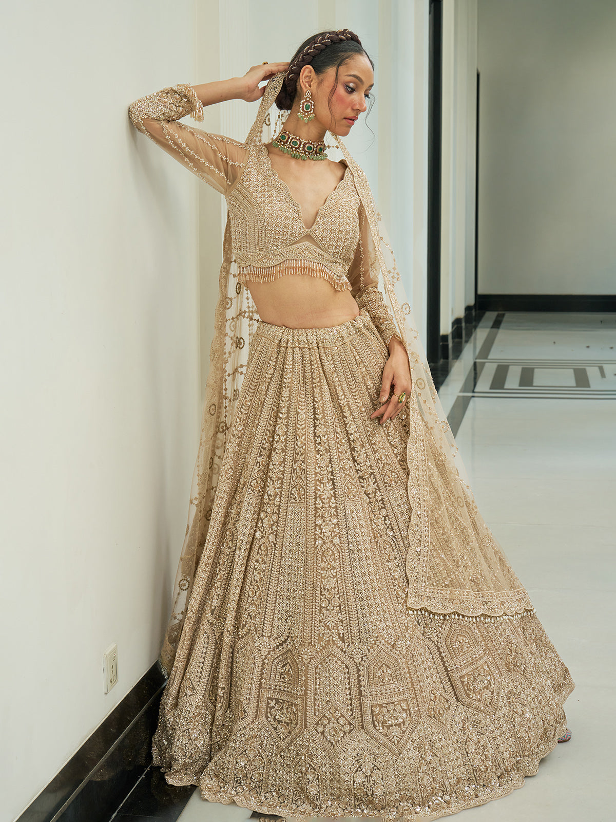 Beige net heavy embroidered lehenga choli with diamond and cutdana